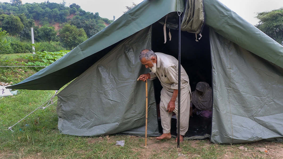 A family takes refuge in makeshift tent in Khari