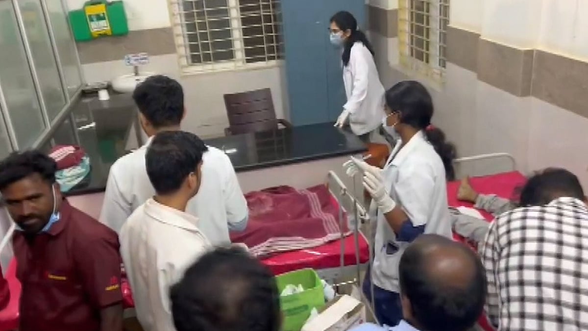 Injured devotees receive treatment at a hospital in Hassan