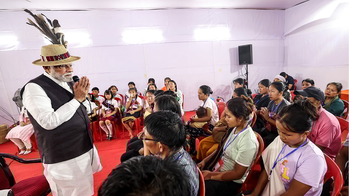 Several Manipuri citizens in the image seem to avoid meeting prime minister Narendra Modi’s eyes