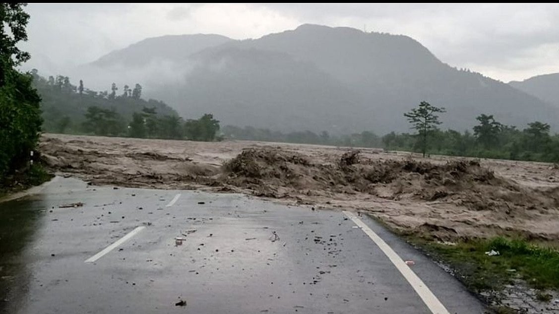 Swollen rivers swept away buildings, bridges and roads