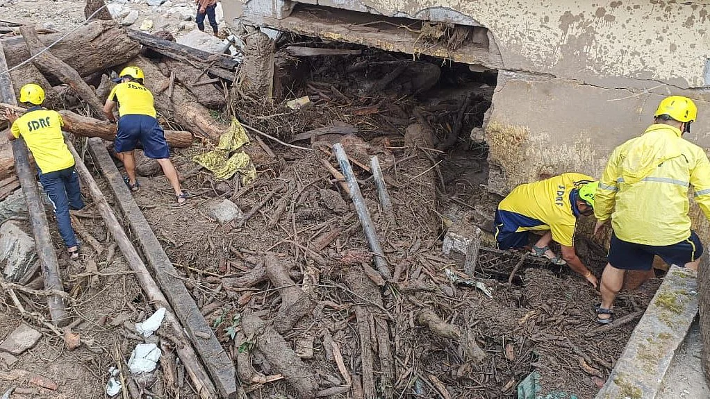 SDRF personnel conducting search and rescue after landslides and floods in Chamoli
