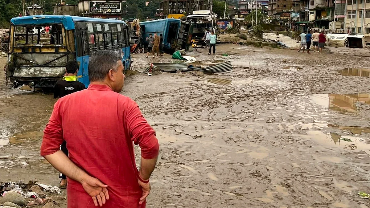 Vehicles lie strewn after a landslide triggered by heavy rains in Shimla