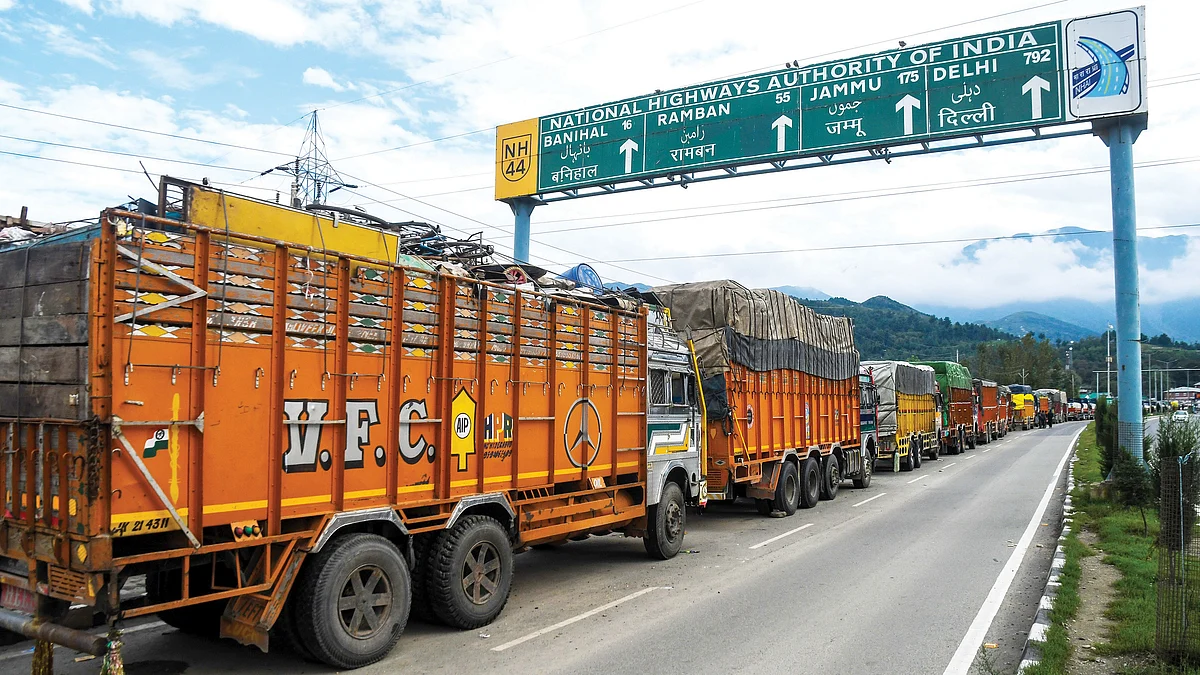 Stranded trucks line up along the Srinagar–Jammu National Highway, closed for the eighth consecutive day