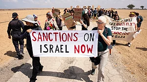 Activists take part in a protest along the Israeli-Gaza border in southern Israel, 19 Sep