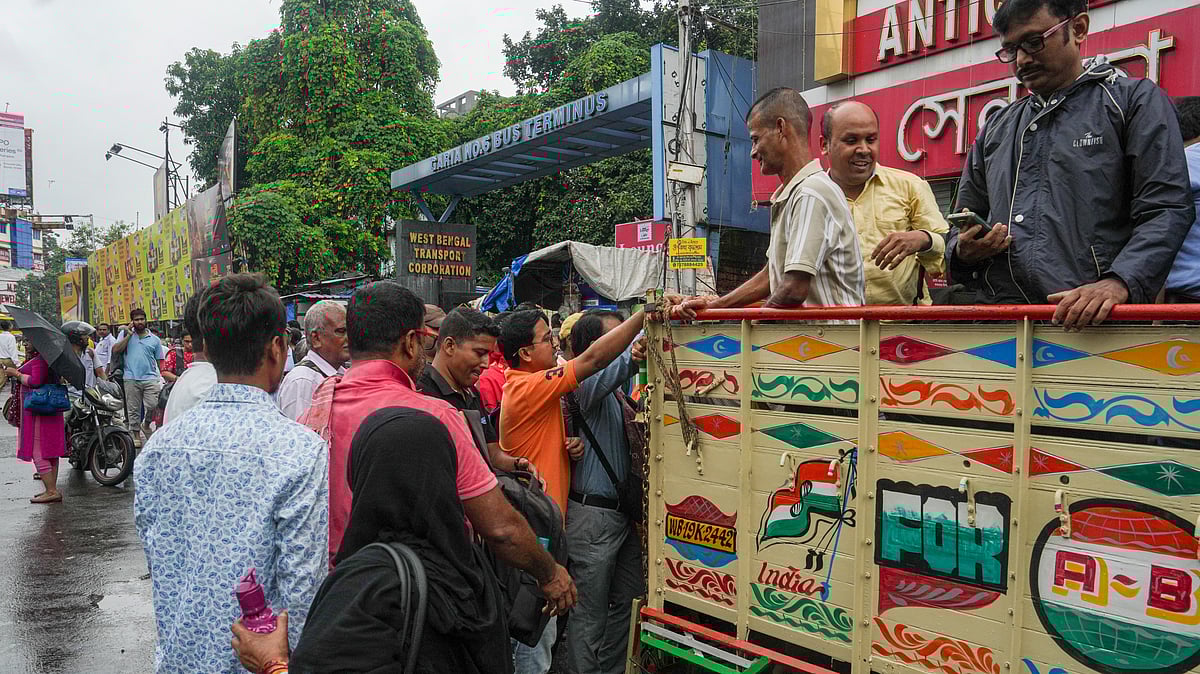 Stranded commuters turn to pickup trucks amid Kolkata’s flooded chaos