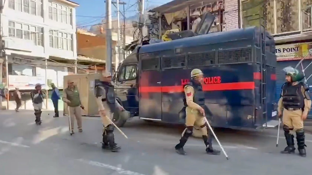 Police stand guard in Leh following violent clashes over statehood and other demands.