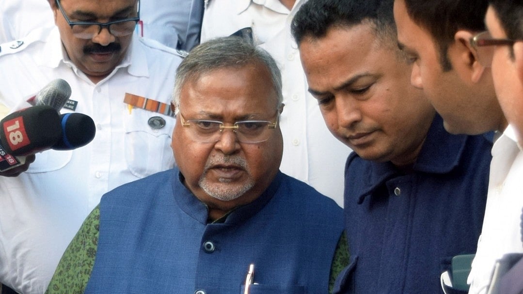 Partha Chatterjee with CBI officials.
