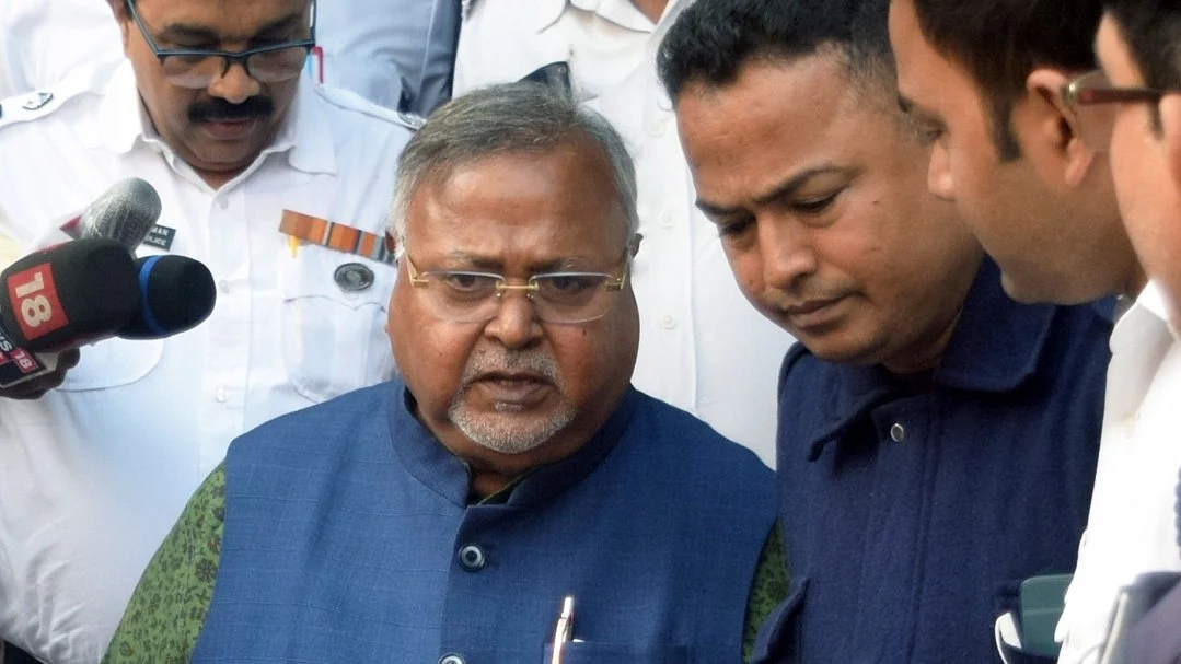 Partha Chatterjee with CBI officials.
