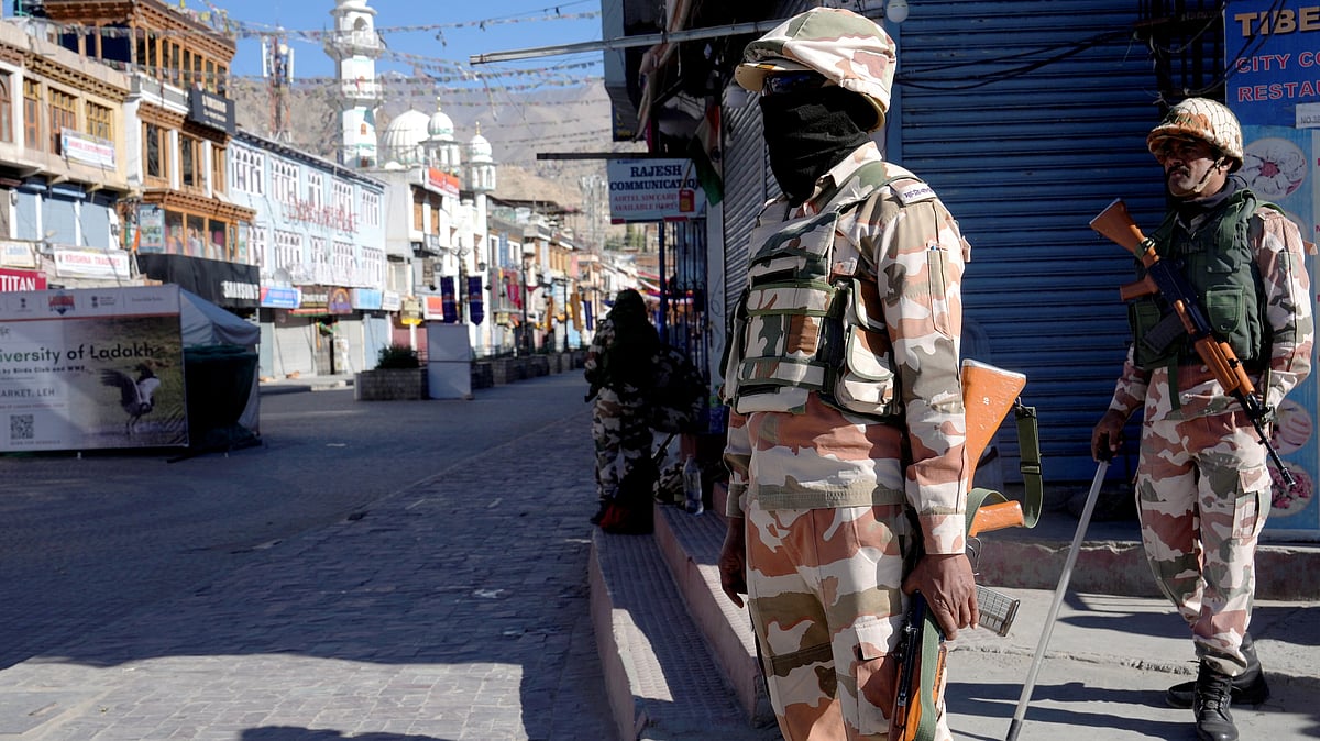 Security personnel stand guard amid a curfew in Leh.