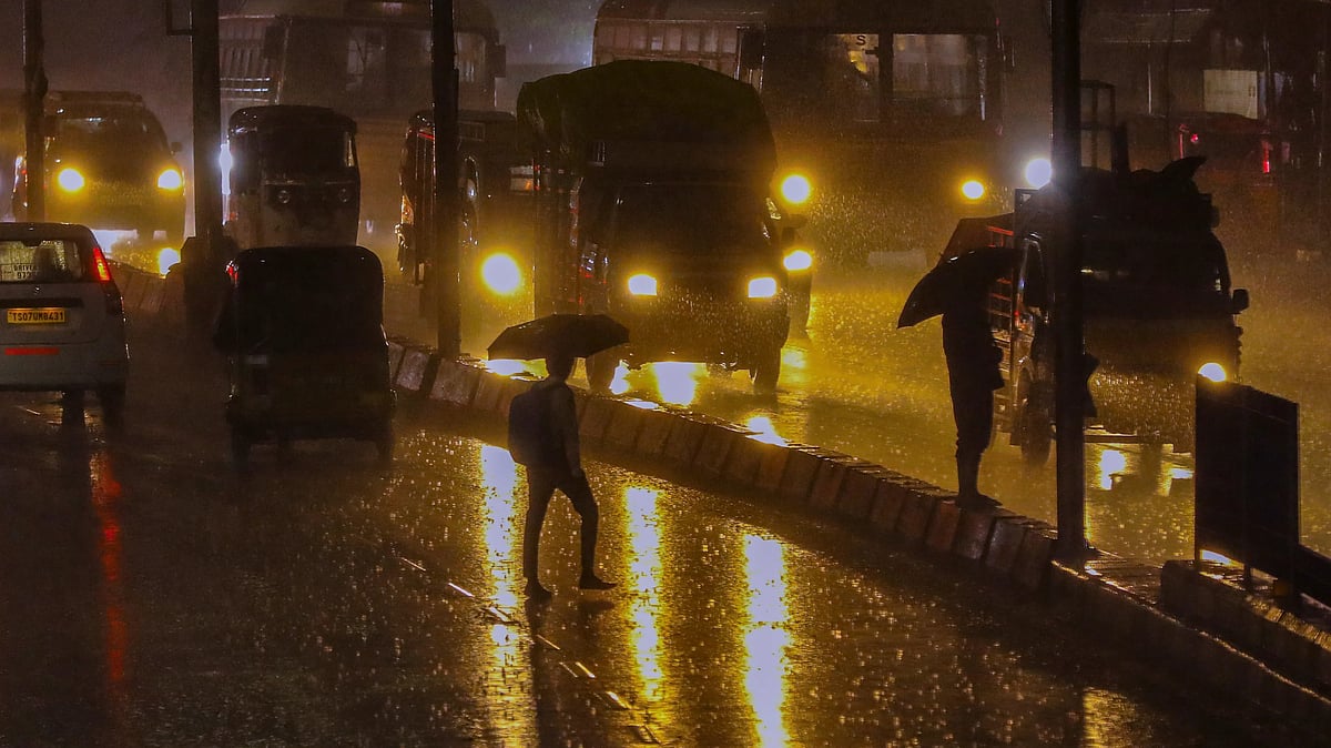 Rain-soaked Hyderabad: Vehicles navigate flooded streets.