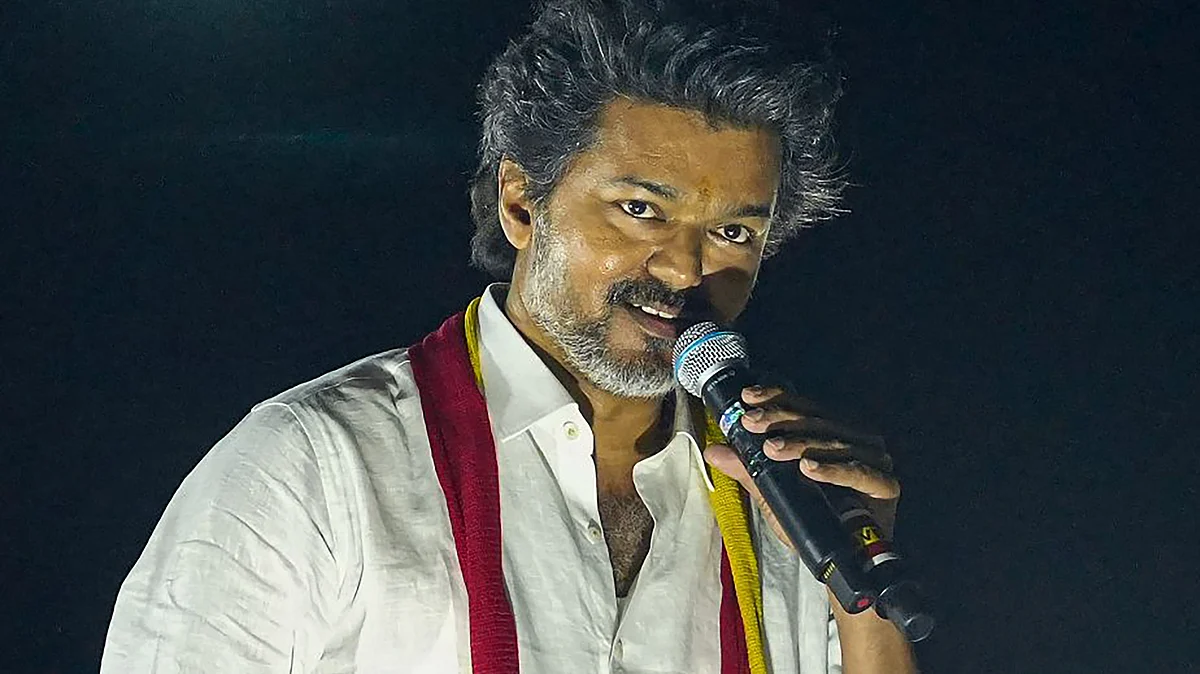 TVK chief and actor Vijay delivers a speech during a road show in Karur on 27 September