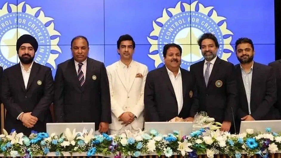 Mithun Manhas (in white suit) being flanked by other top officials at the AGM