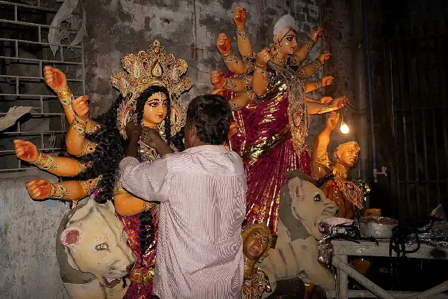 In this Bengal village, it is the traditional occupation of Muslim artisans to weave the Goddess’ wavy hair