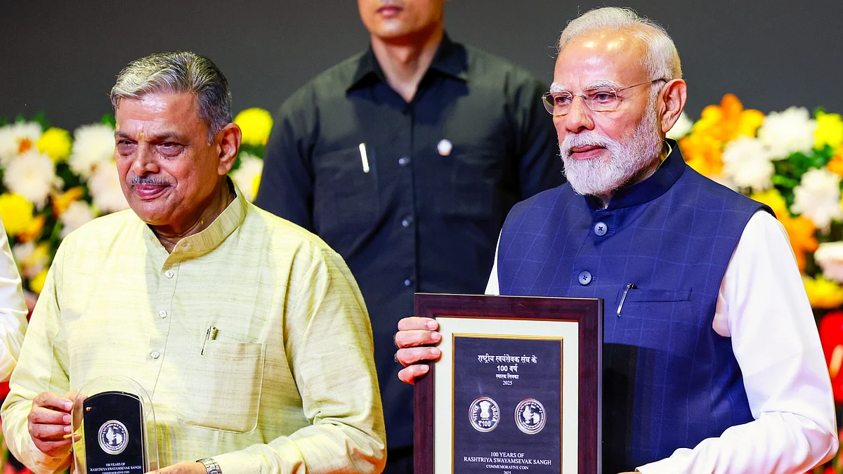 PM Modi and RSS leader Dattatreya Hosabale at an RSS centenary event in New Delhi, 1 Oct