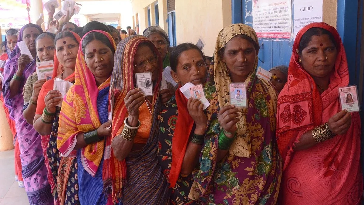 Women voters queue up at a polling booth (Representational Image)