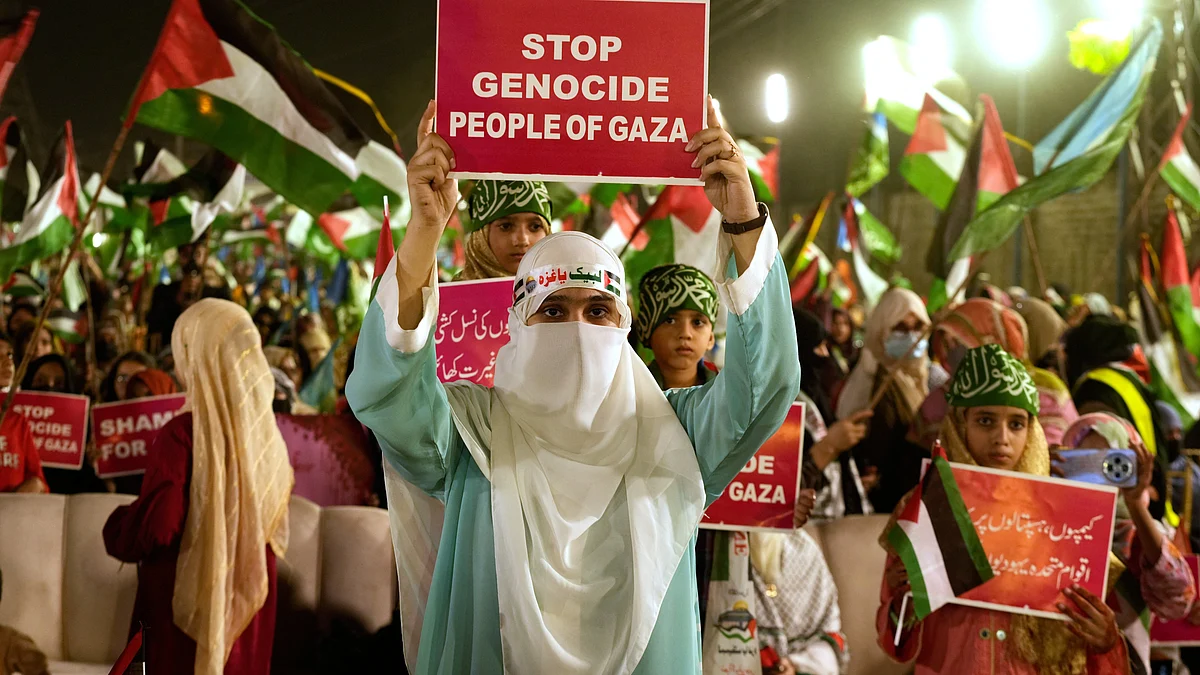 Jamaat-e-Islami supporters march in Lahore to show solidarity with Palestinians in Gaza on 4 October.