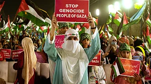 Jamaat-e-Islami supporters march in Lahore to show solidarity with Palestinians in Gaza on 4 October.