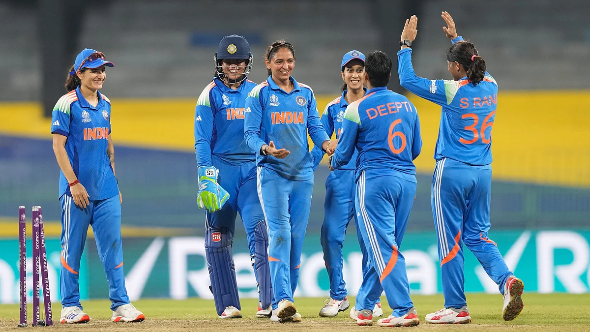 Harmanpreet Kaur and teammates celebrate Rameen Shamim’s wicket in Colombo on 5 October.
