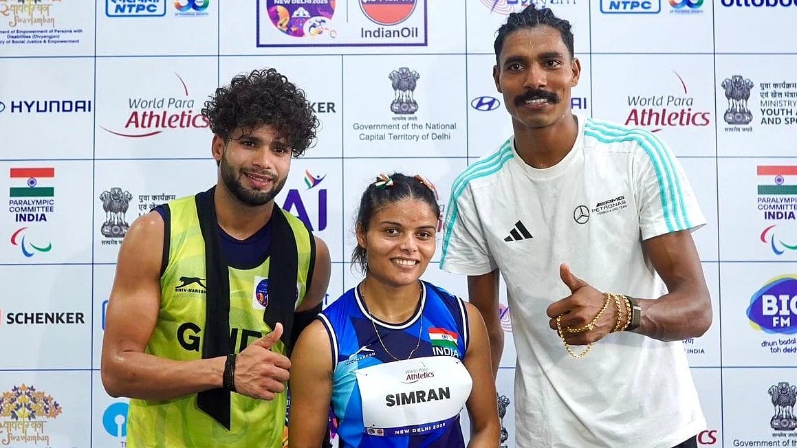 Golden pair: Simran (centre) and Nishad Kumar (right) finish on a high for India at the global event