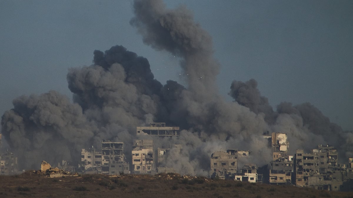 Smoke rises over the Gaza Strip after an Israeli airstrike on 5 October.