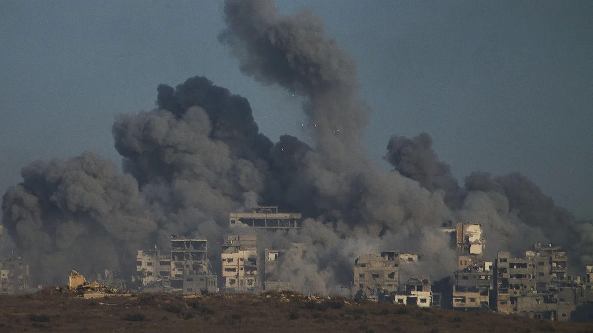 Smoke rises over the Gaza Strip after an Israeli airstrike on 5 October.