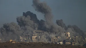 Smoke rises over the Gaza Strip after an Israeli airstrike on 5 October.