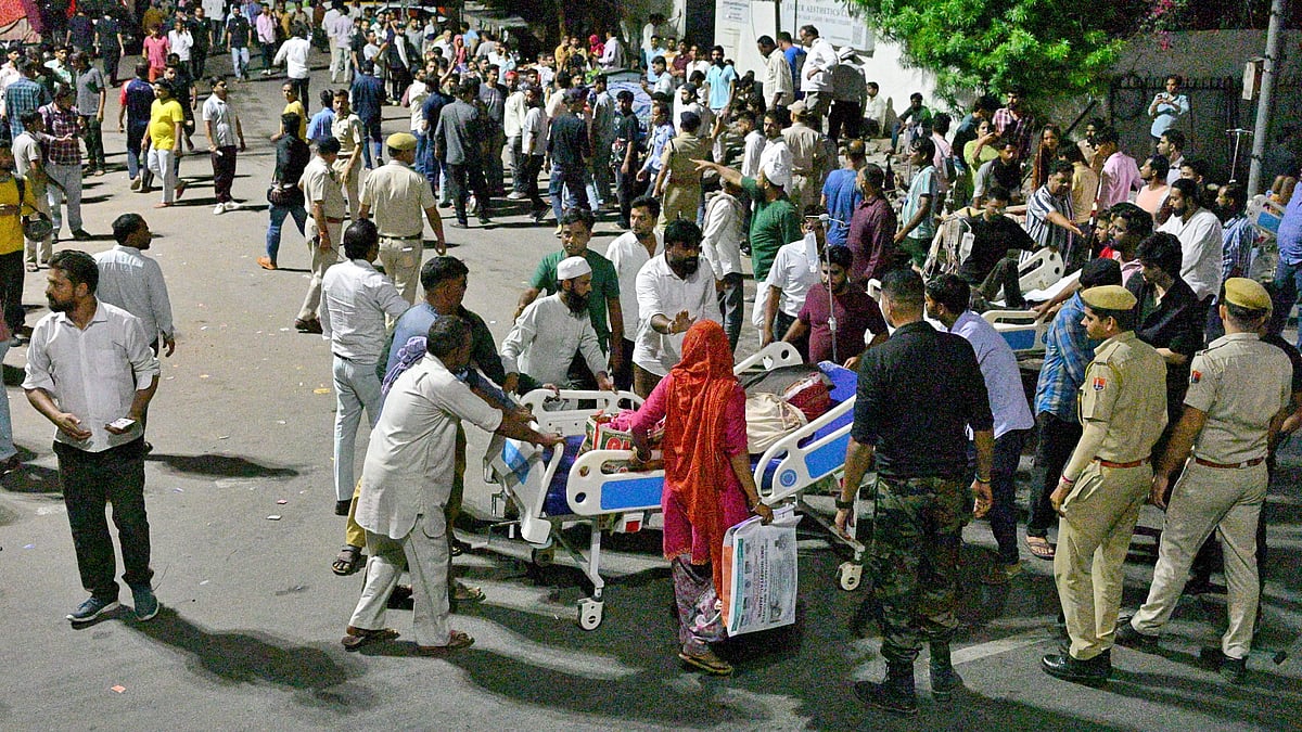 Patients and staff gather outside SMS Hospital in Jaipur