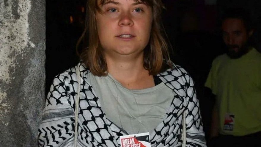 Greta Thunberg with her keffiyeh and 'Break the Seige' badge as a member of the Global Sumud Flotilla