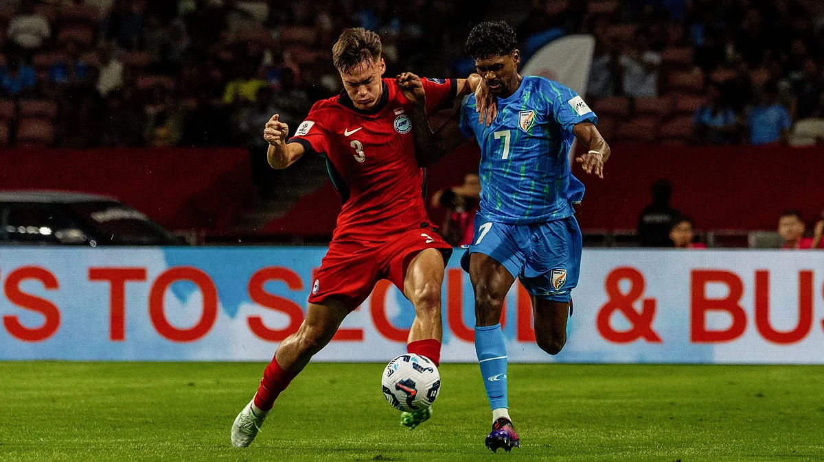 India's Liston Colaço being challenged by a Singapore defender