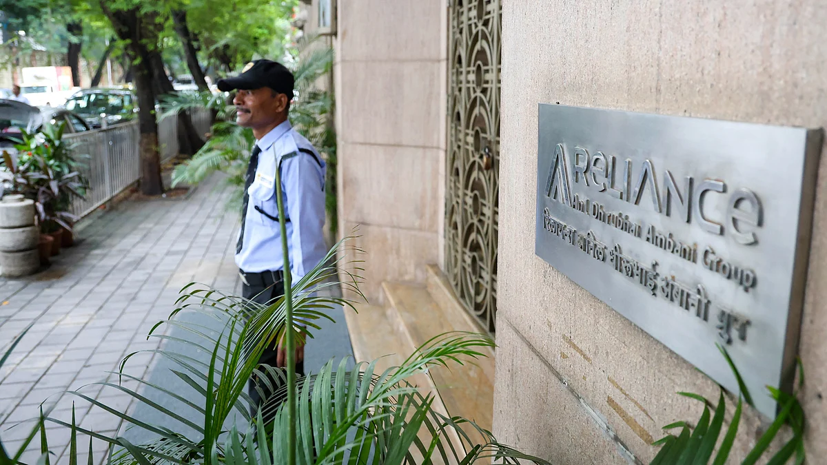 A security guard stands outside industrialist Anil Ambani's office in Mumbai.
