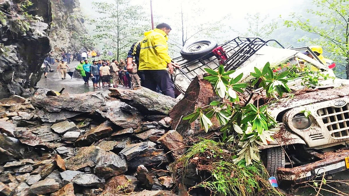 A vehicle crushed under boulders and debris following heavy rains in Sonprayag, Uttarakhand