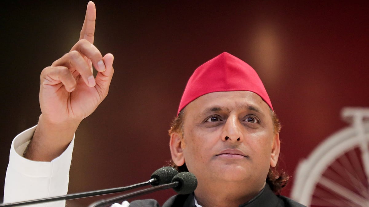 SP chief Akhilesh Yadav addresses supporters at a political meeting.