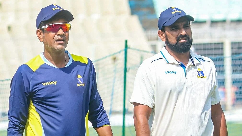 Look who's back: Shami (right) with Bengal coach Laxmi Ratan Shukla at the Eden Gardens
