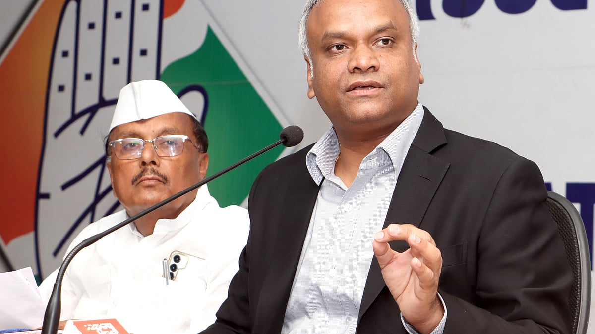Priyank Kharge addresses a press conference in Bengaluru.