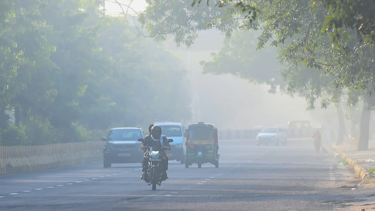 A smoggy morning in Noida as commuters navigate rising air pollution levels.