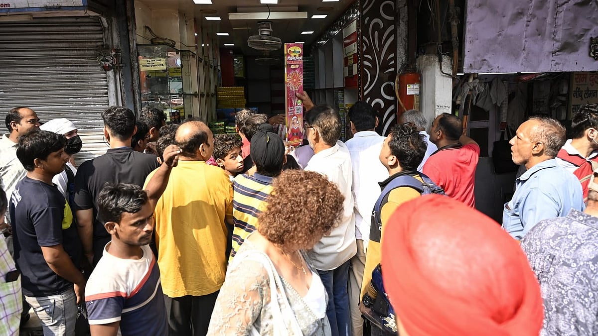 Delhi residents throng a firecracker shop ahead of Diwali celebrations.