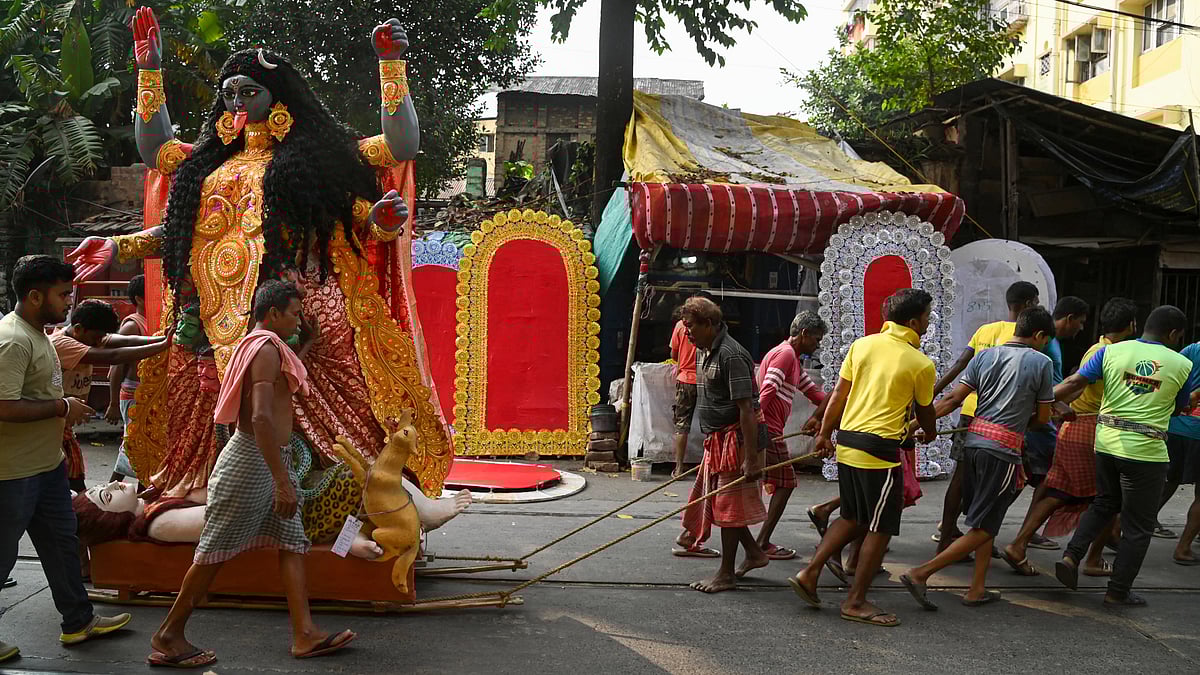 An idol of Goddess Kali being taken to a place of worship in Kolkata.