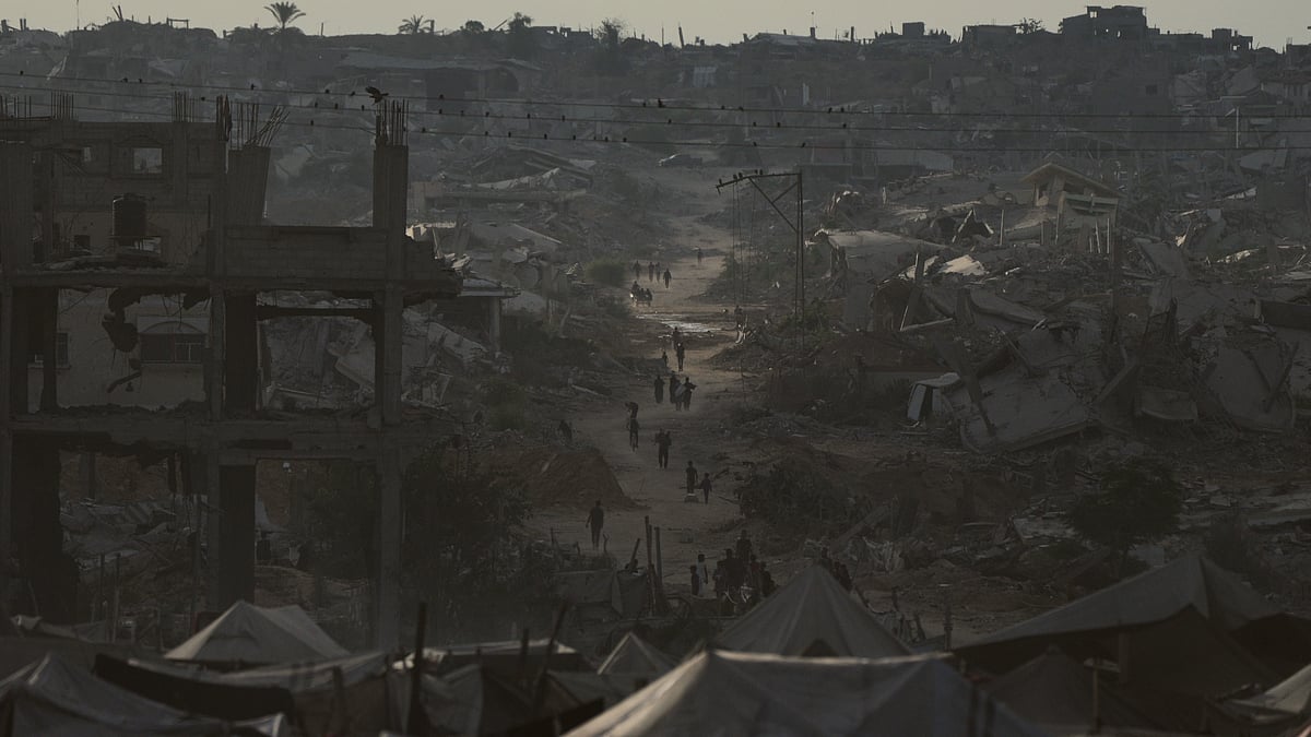 Displaced Palestinians navigate the rubble of destroyed homes in Khan Younis.