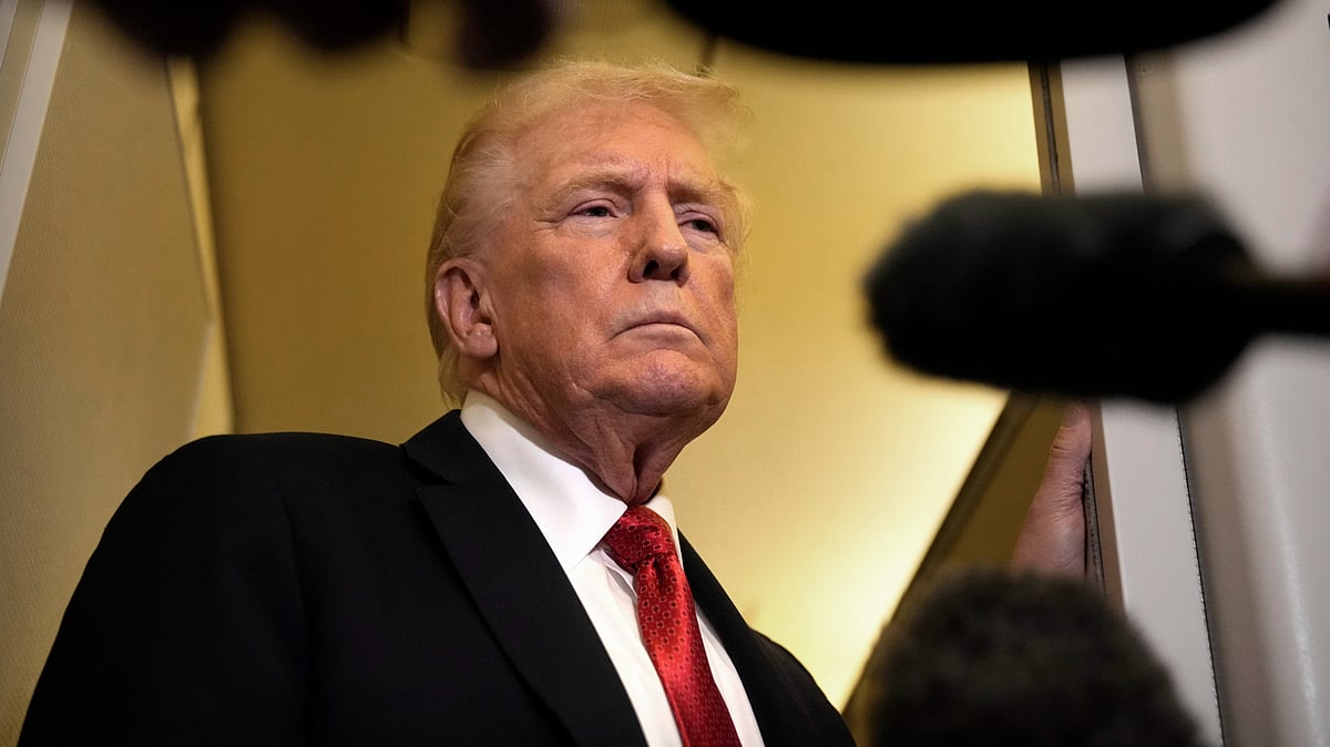 Donald Trump speaks to reporters aboard Air Force One, 19 Oct