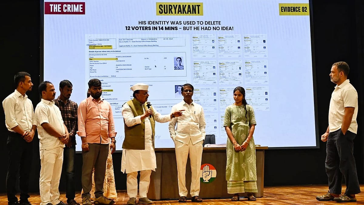 Rahul Gandhi (right) with voters from Aland at his 18 Sep press conference