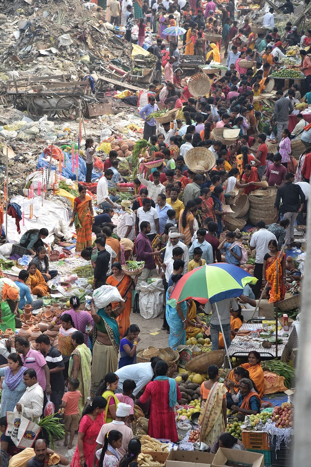 Women preparing ritual prasad with devotion during Chhath Puja.