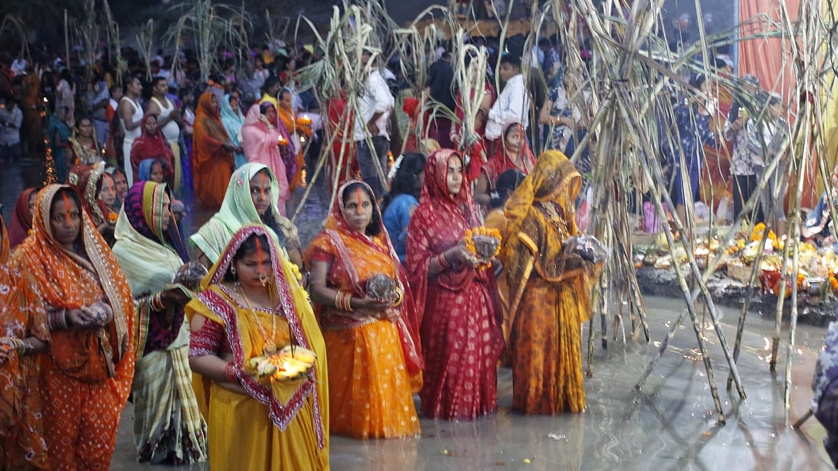 Devotees offer prayers on the banks of the Yamuna during Chhath Puja in New Delhi.