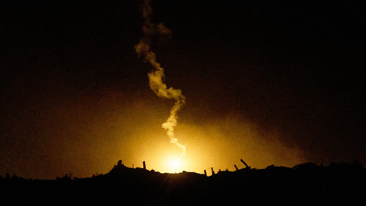 An Israeli army flare drifts over northern Gaza Strip, as seen from southern Israel, 28 Oct