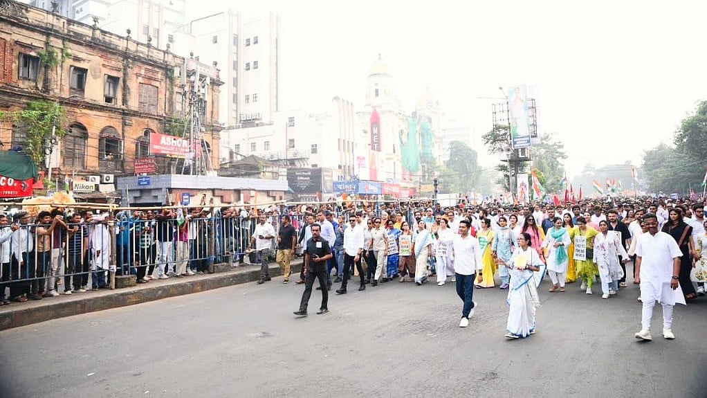 Mamata and Abhishek Banerjee lead the SIR protest rally in Kolkata