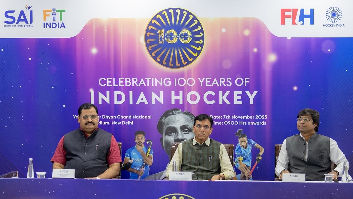 Mansukh Mandaviya (centre), Dilip Tirkey (right) and Hockey India secretary Bhola Nath Singh