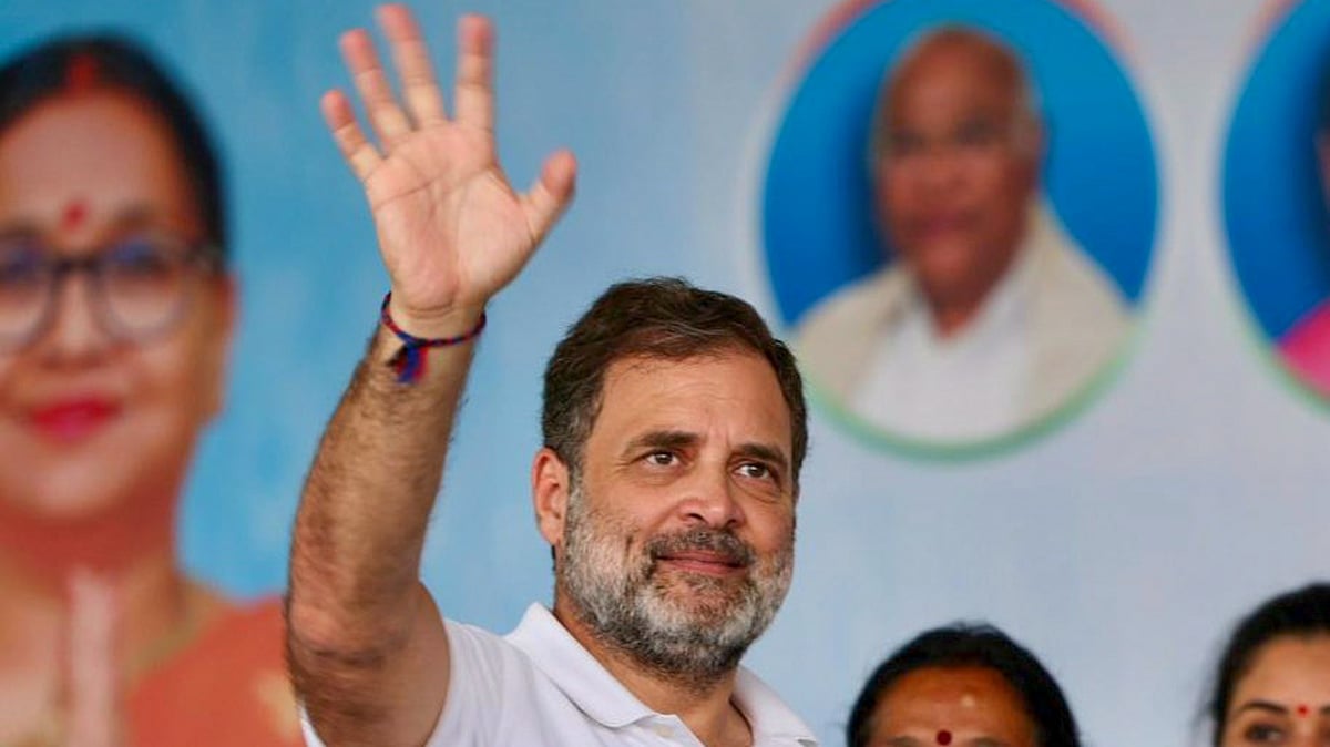 Rahul Gandhi waves to supporters during a rally in Begusarai.