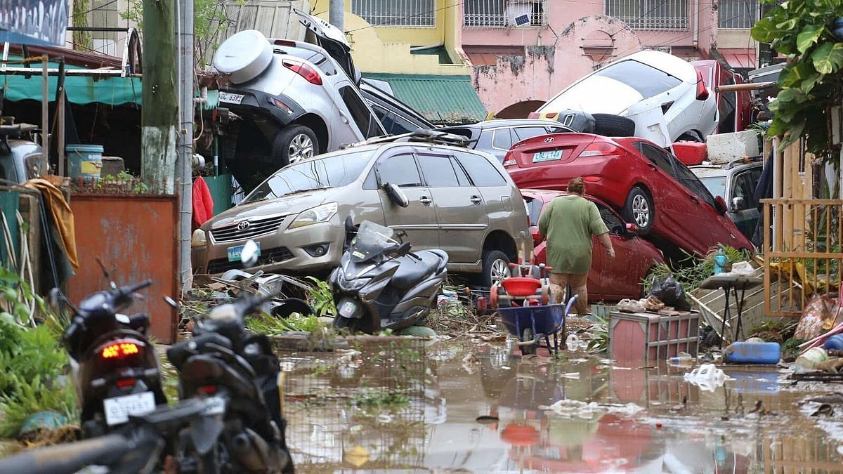 Vehicles lie piled after flooding caused by Typhoon Kalmaegi in Cebu city, central Philippines