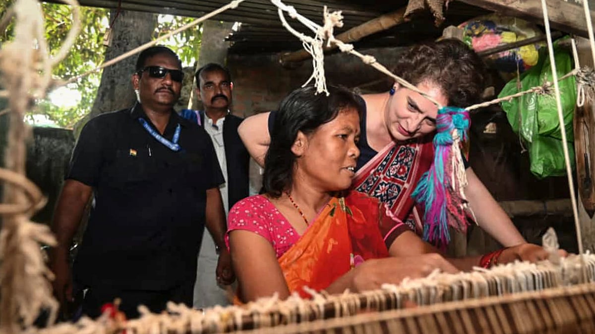 Congress MP Priyanka Gandhi Vadra interacts with a weaver in Valmiki Nagar