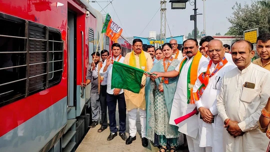 BJP's Panipat district chief Dushyant Bhatt flagging off a spl train to Bihar