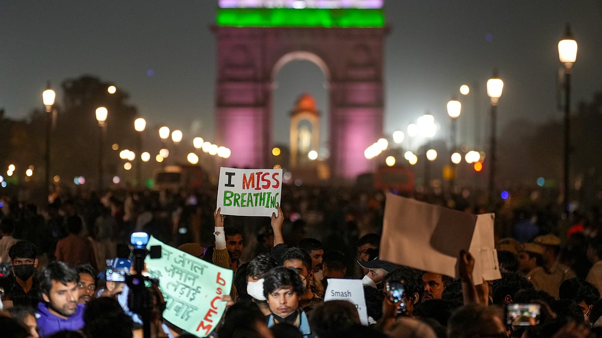 People protest at India Gate, demanding action on Delhi’s worsening air quality.